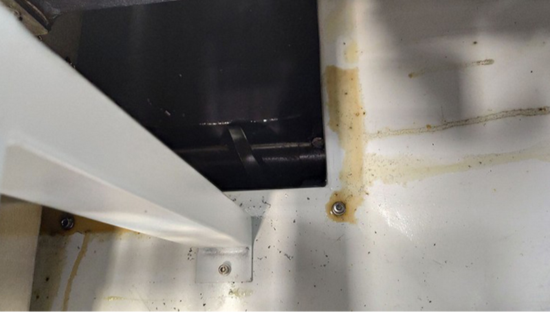 Before-and-after comparison image showing improved surface finish on an automotive mold part machined using the DC1317 with enhanced fixture rigidity.