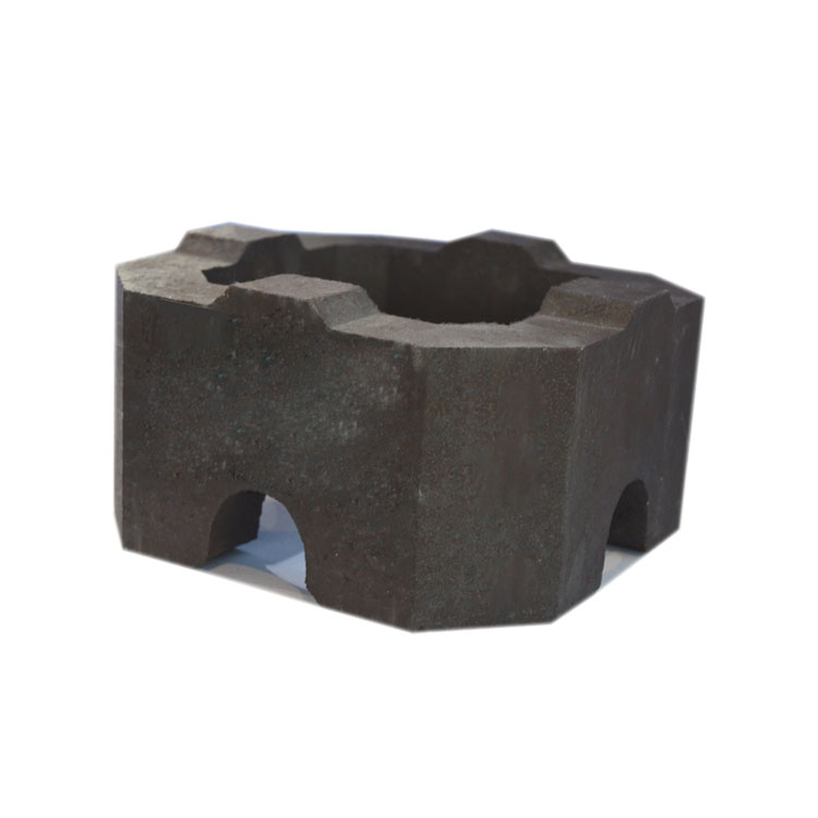 Workers inspecting refractory bricks in a chemical furnace