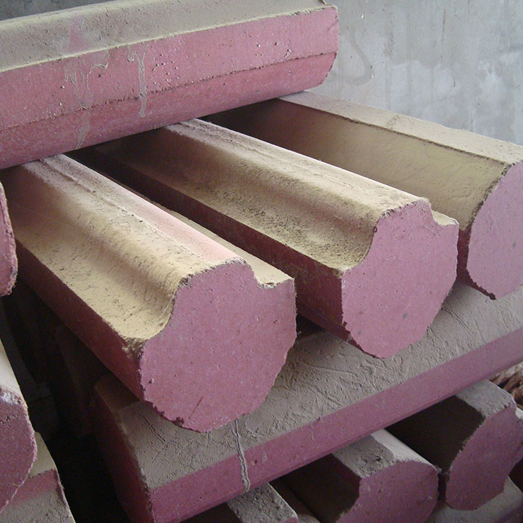 Close-up view of magnesia-chrome brick surface showing minimal erosion after extended use in industrial furnace