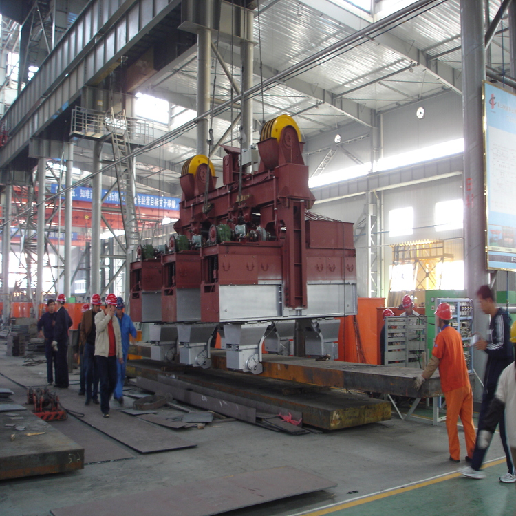 Hydraulic power clamp securely gripping hot rolled steel plate in a rolling mill