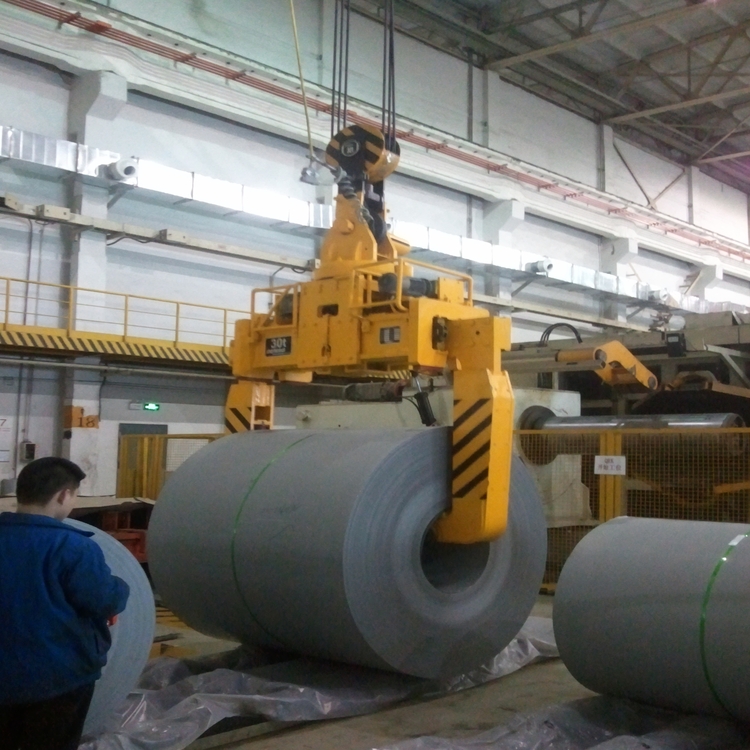 Horizontal steel coil spreaders in a steel mill