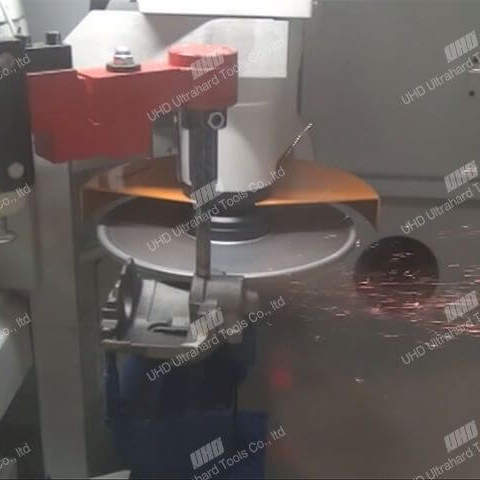 Industrial setup showing brazed diamond grinding wheel on stainless steel