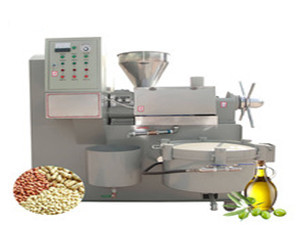User using the oil press