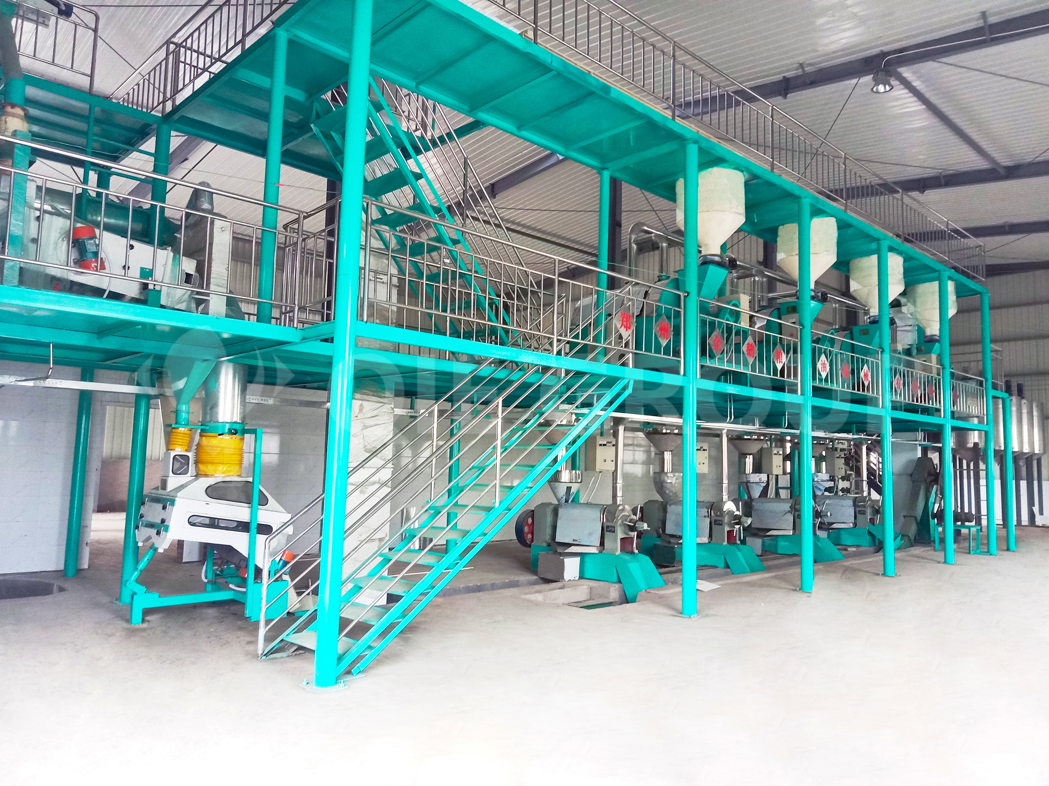 An industrial complex for oil extraction, designed to reduce oil loss and improve pressing efficiency through optimized process equipment