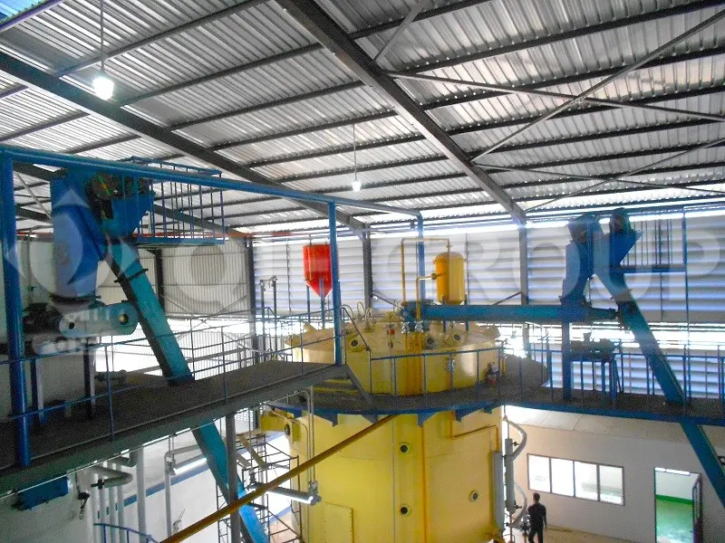 Palm kernel oil extraction workshop under construction with an extractor and DTDC system.