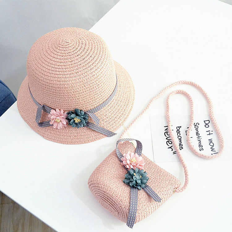 Woman holding a bright yellow paper straw tote on a tropical beach, smiling at the camera