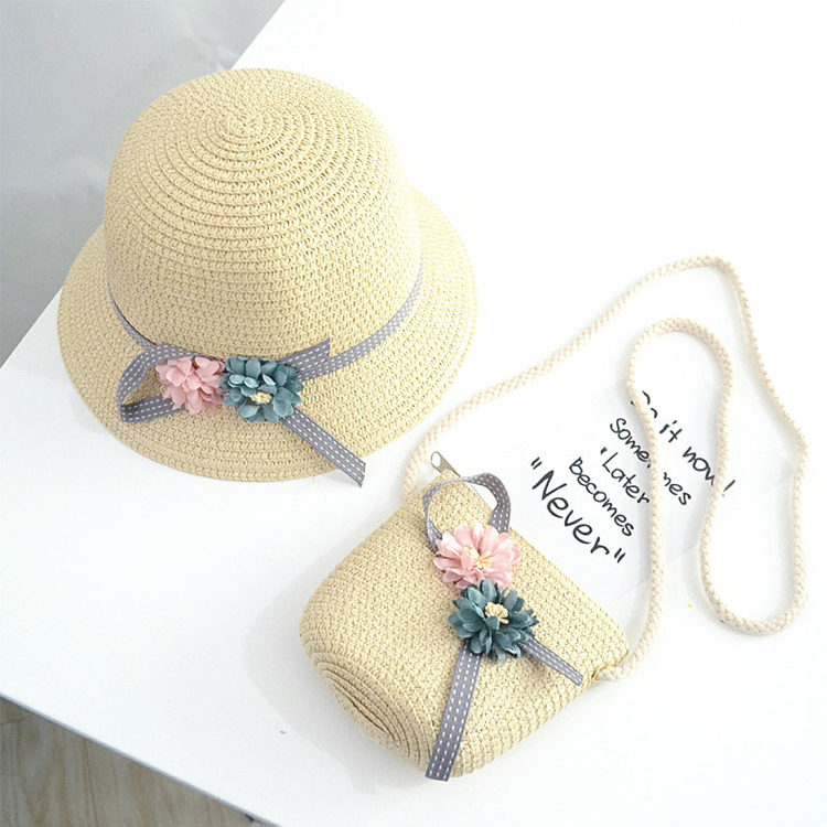 Close-up of the inside of the paper straw tote showing multiple compartments and a zippered pocket for small items