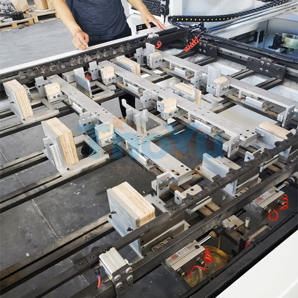 The fully automatic pallet - leg nailing machine in operation