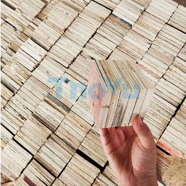 Team members practicing on the pallet leg nailing machine during hands-on training