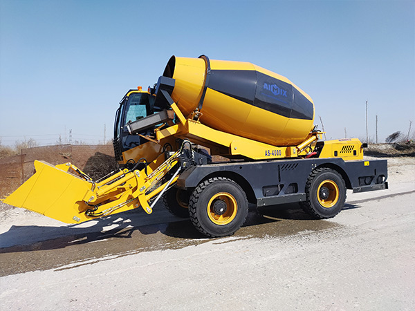 Close-up view of the dual-spiral mixing blades inside the AIMIX AS-6.5 drum, showing precise blade alignment and rotation direction.