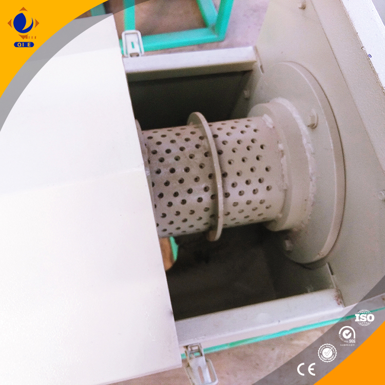 Production environment displaying spiral oil press with segmented bearing cage