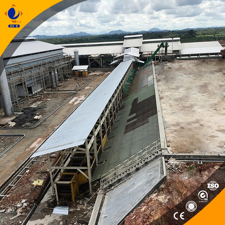 Technician performing safety check and equipment maintenance on palm oil refining machine