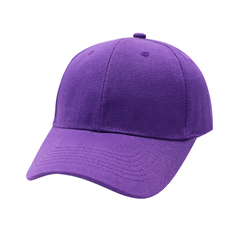 A close-up of a custom velvet baseball cap with embroidered logo on a white background, showing texture and craftsmanship details.